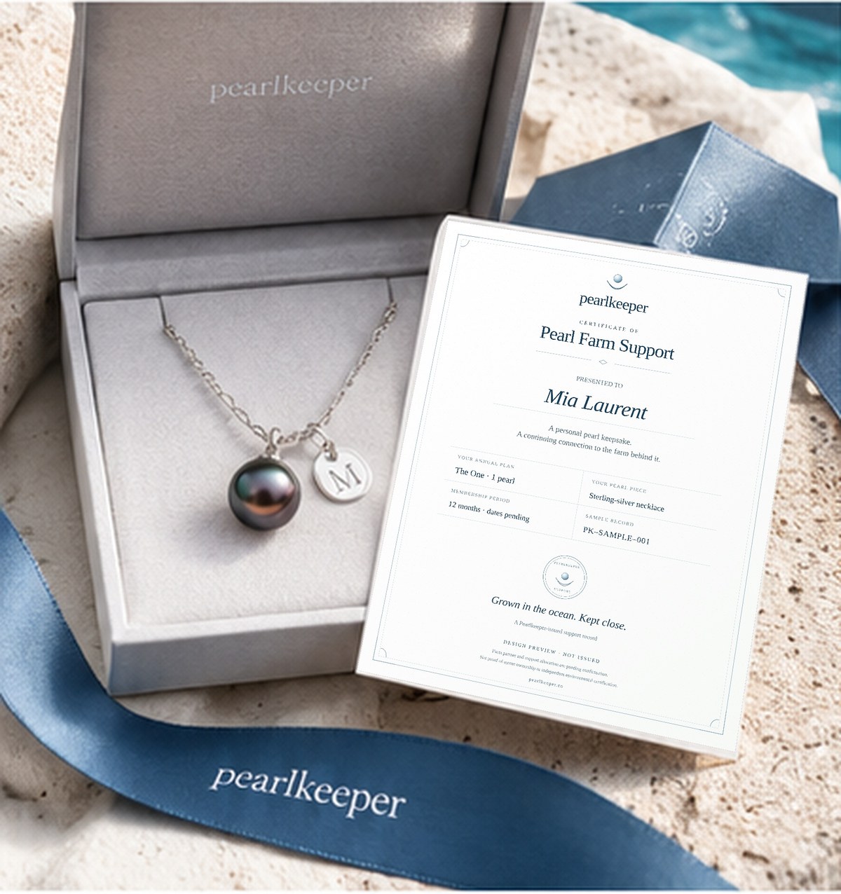 Sample Pearlkeeper farm-support certificate beside a boxed pearl necklace and blue ribbon